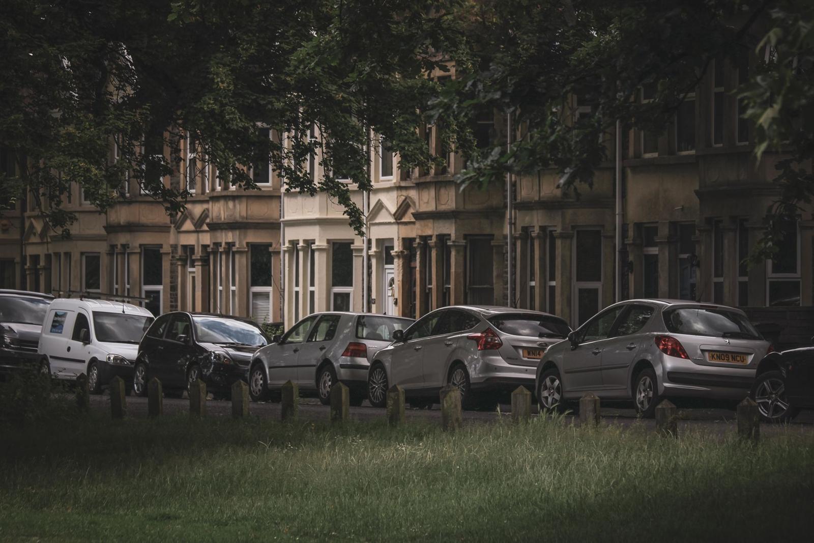 Cars parked for the night on a quiet terraced street
